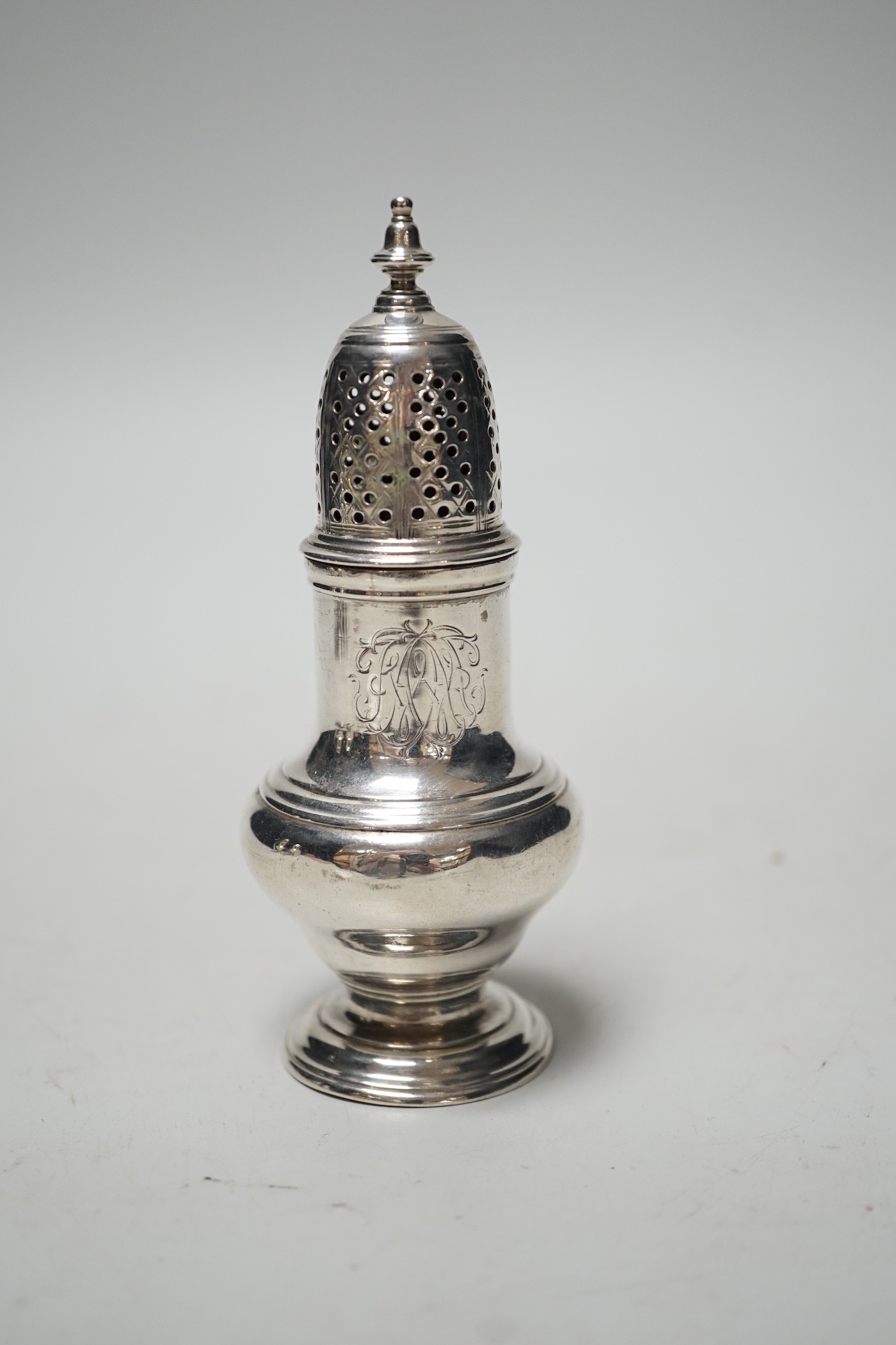 A George II silver baluster pepperette, Samuel Wood, London, 1751, 12.2cm, 90 grams.